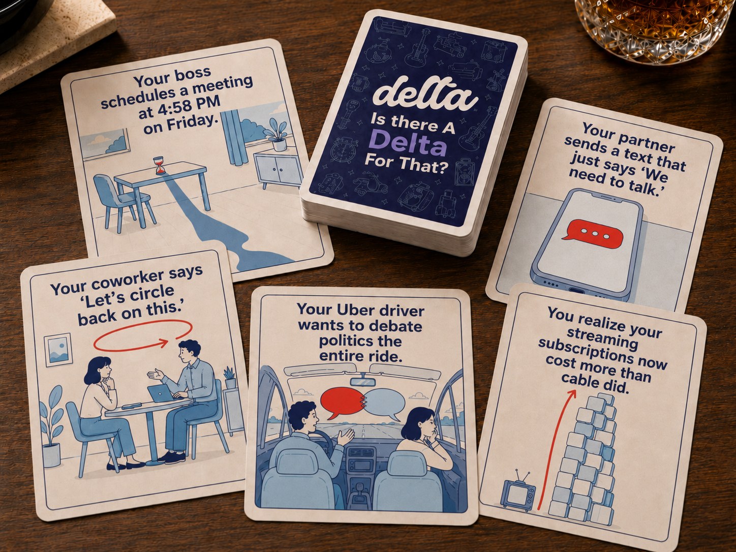 Physical Delta card game deck and prompt cards on a table